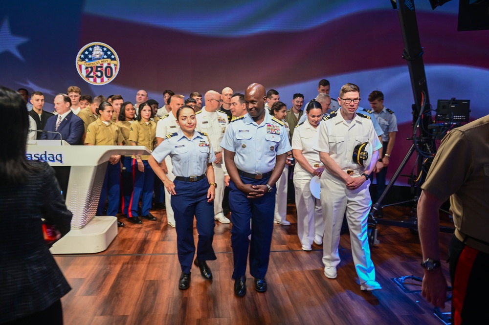 Service members of the U.S. Coast Guard,  Navy and Marine Corps ring the Nasdaq Opening Bell at the MarketSite in Times Square, officially marking the start of the trading day during Fleet Week New York 2025