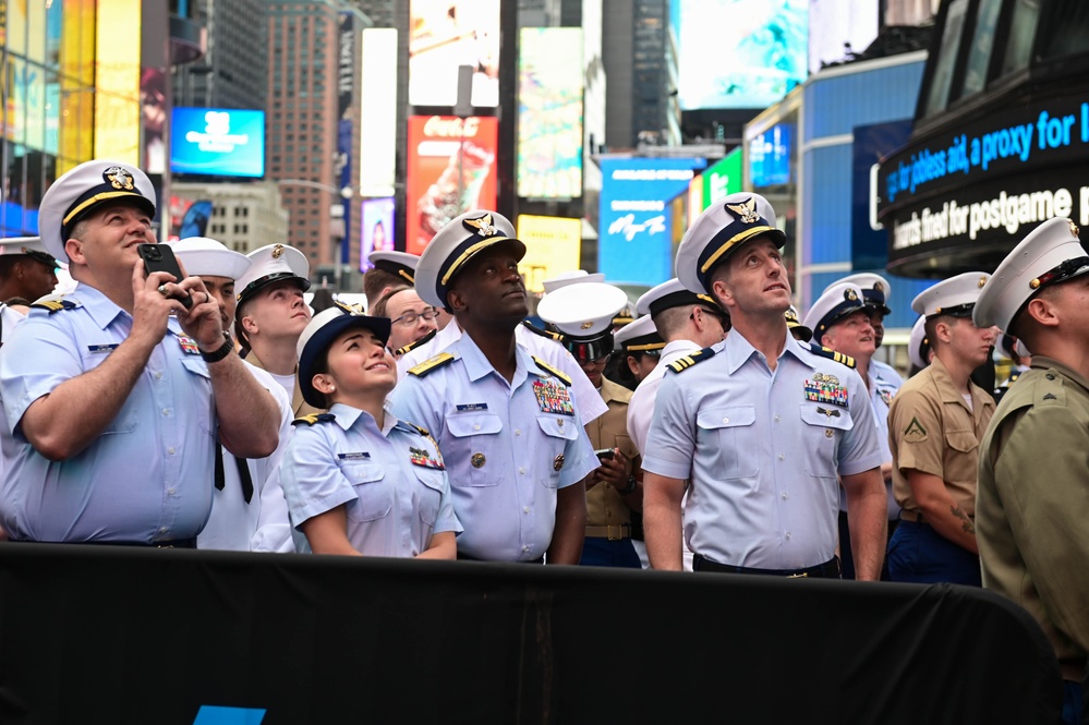 Service members of the U.S. Coast Guard,  Navy and Marine Corps ring the Nasdaq Opening Bell at the MarketSite in Times Square, officially marking the start of the trading day during Fleet Week New York 2025