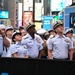 Service members of the U.S. Coast Guard,  Navy and Marine Corps ring the Nasdaq Opening Bell at the MarketSite in Times Square, officially marking the start of the trading day during Fleet Week New York 2025