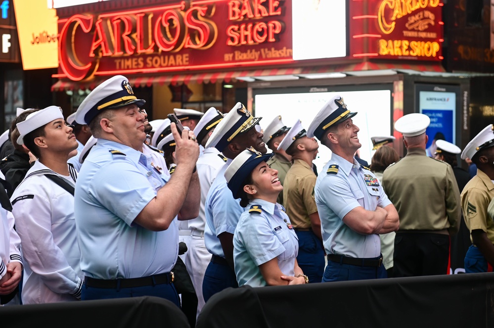 Service members of the U.S. Coast Guard,  Navy and Marine Corps ring the Nasdaq Opening Bell at the MarketSite in Times Square, officially marking the start of the trading day during Fleet Week New York 2025