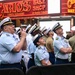 Service members of the U.S. Coast Guard,  Navy and Marine Corps ring the Nasdaq Opening Bell at the MarketSite in Times Square, officially marking the start of the trading day during Fleet Week New York 2025