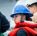 Sailor Uses Signal Paddles