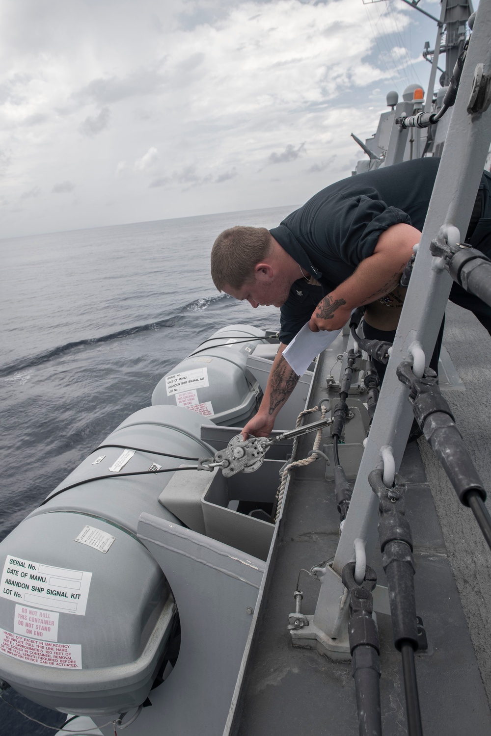 Sailor Conducts Maintenance