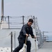 Sailor Inspects Equipment