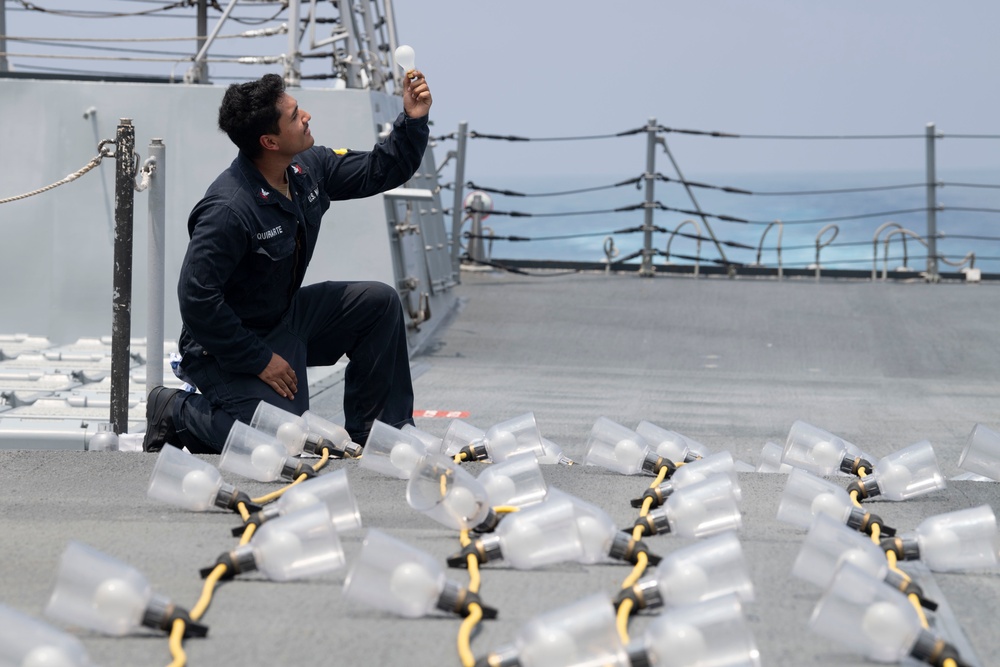 Sailor Inspects Equipment