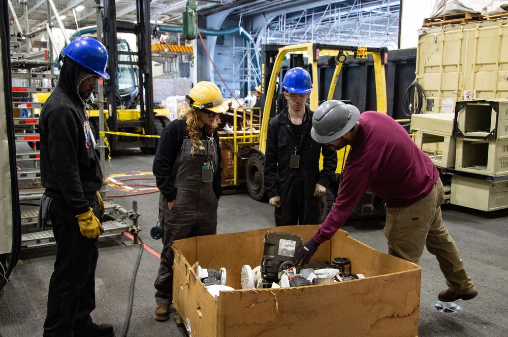 Contractors and Puget Sound Naval Shipyard workers conduct routine operations and ship maintenance aboard USS Ronald Reagan (CVN 76)