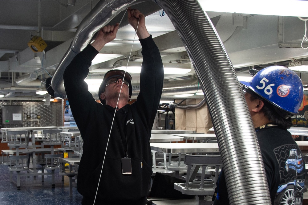 Contractors and Puget Sound Naval Shipyard workers conduct routine operations and ship maintenance aboard USS Ronald Reagan (CVN 76)