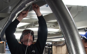 Contractors and Puget Sound Naval Shipyard workers conduct routine operations and ship maintenance aboard USS Ronald Reagan (CVN 76)