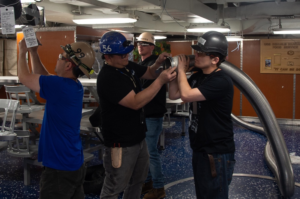 Contractors and Puget Sound Naval Shipyard workers conduct routine operations and ship maintenance aboard USS Ronald Reagan (CVN 76)
