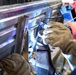 USS Preble Sailor Repairs Equipment