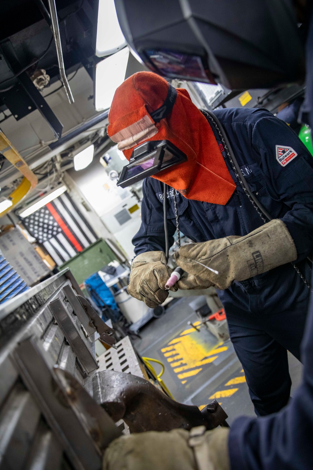 USS Preble Sailor Repairs Equipment