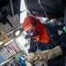 USS Preble Sailor Repairs Equipment