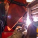 USS Preble Sailor Repairs Equipment