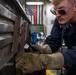 USS Preble Sailor Repairs Equipment