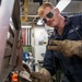 USS Preble Sailor Repairs Equipment