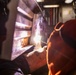 USS Preble Sailor Repairs Equipment