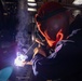 USS Preble Sailor Repairs Equipment