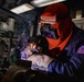 USS Preble Sailor Repairs Equipment