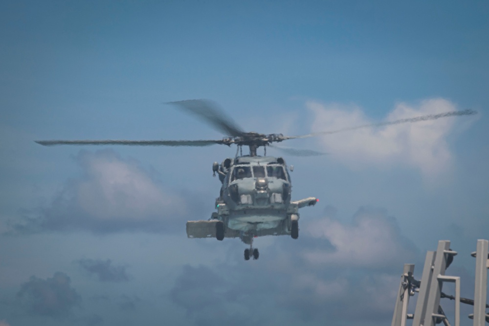 Helicopter lands on flight deck