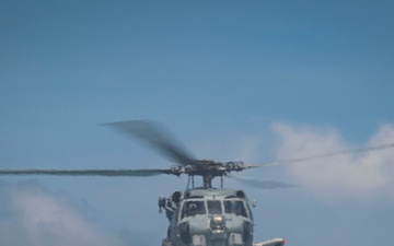 Helicopter lands on flight deck