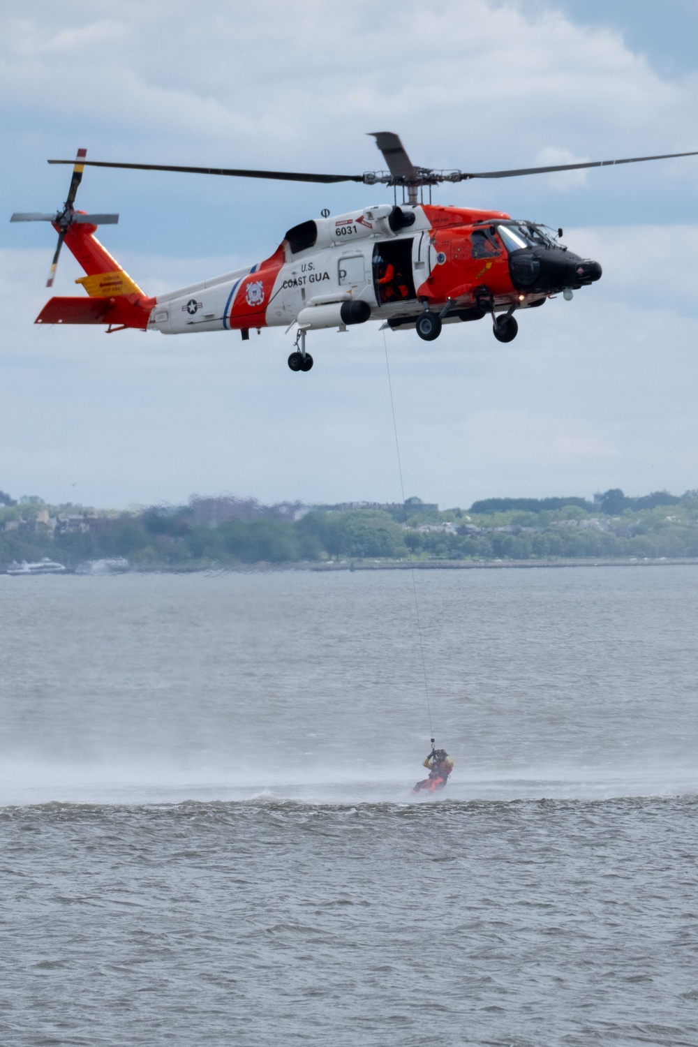 U.S. Coast Guard Air Station Cape Cod MH-60 Jayhawk conducts a search and rescue demonstration during Fleet Week NYC.