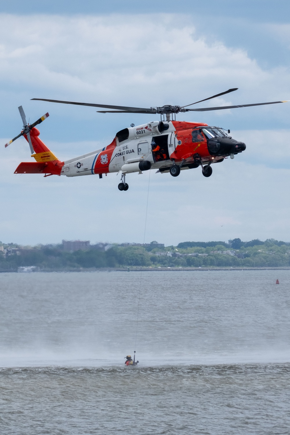 U.S. Coast Guard Air Station Cape Cod MH-60 Jayhawk conducts a search and rescue demonstration during Fleet Week NYC.