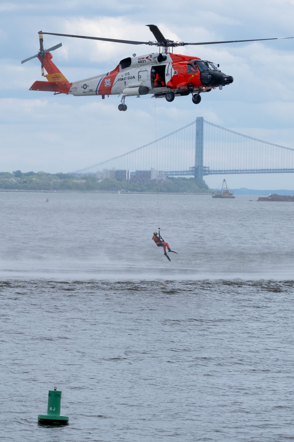 U.S. Coast Guard Air Station Cape Cod MH-60 Jayhawk conducts a search and rescue demonstration during Fleet Week NYC.