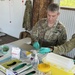 Service members make blood smears as part of the disease surveillance efforts at No Sick Soljia 2025 in Wewak, Papua New Guinea.