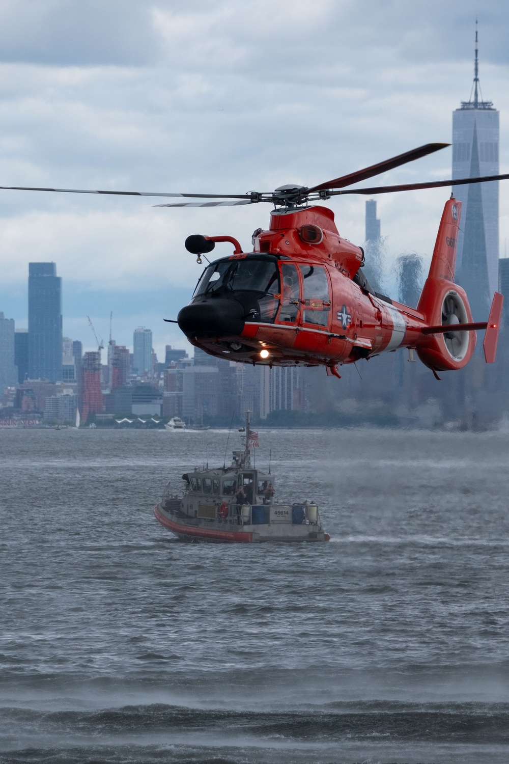 U.S. Coast Guard MH-65 dolphin conducts a search and rescue demonstration off the Homeport Pier in Staten Island during Fleet Week NYC 2025.