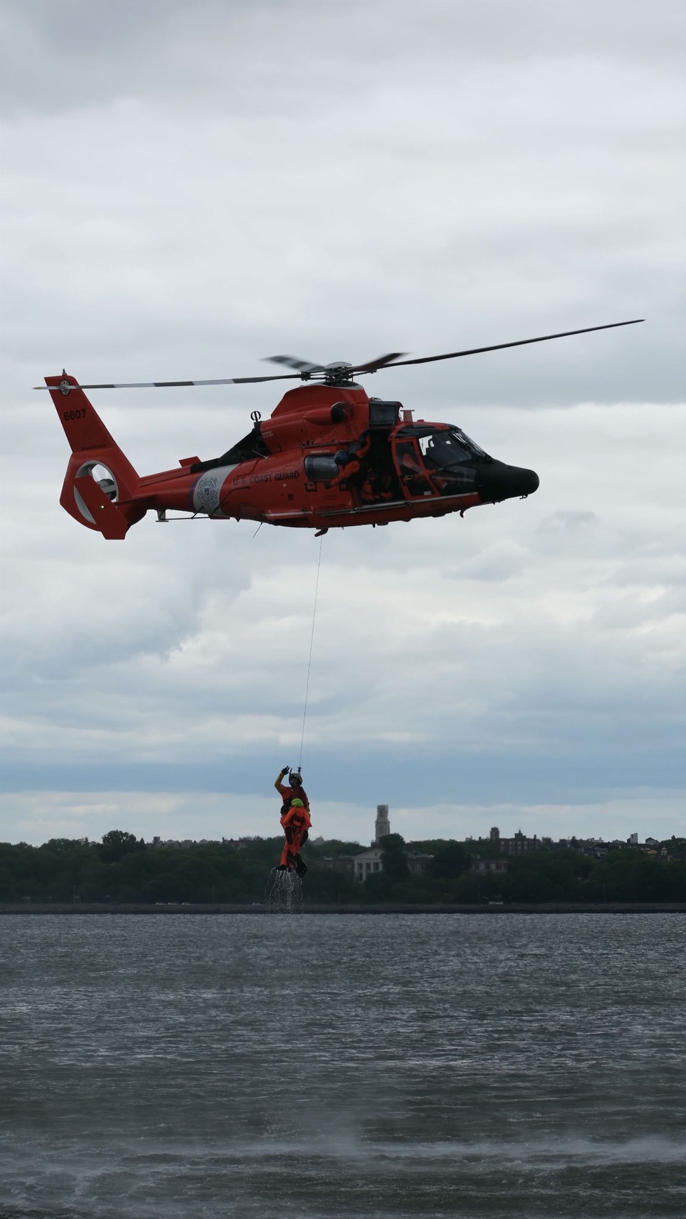 U.S. Coast Guard MH-65 dolphin conducts a search and rescue demonstration off the Homeport Pier in Staten Island during Fleet Week NYC 2025.
