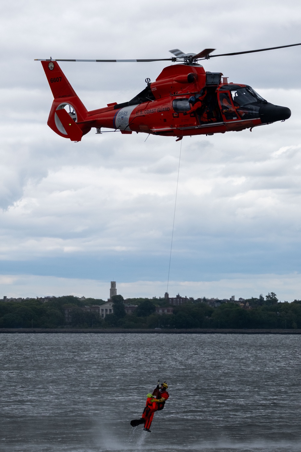 U.S. Coast Guard MH-65 dolphin conducts a search and rescue demonstration off the Homeport Pier in Staten Island during Fleet Week NYC 2025.