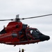 U.S. Coast Guard MH-65 dolphin conducts a search and rescue demonstration off the Homeport Pier in Staten Island during Fleet Week NYC 2025.