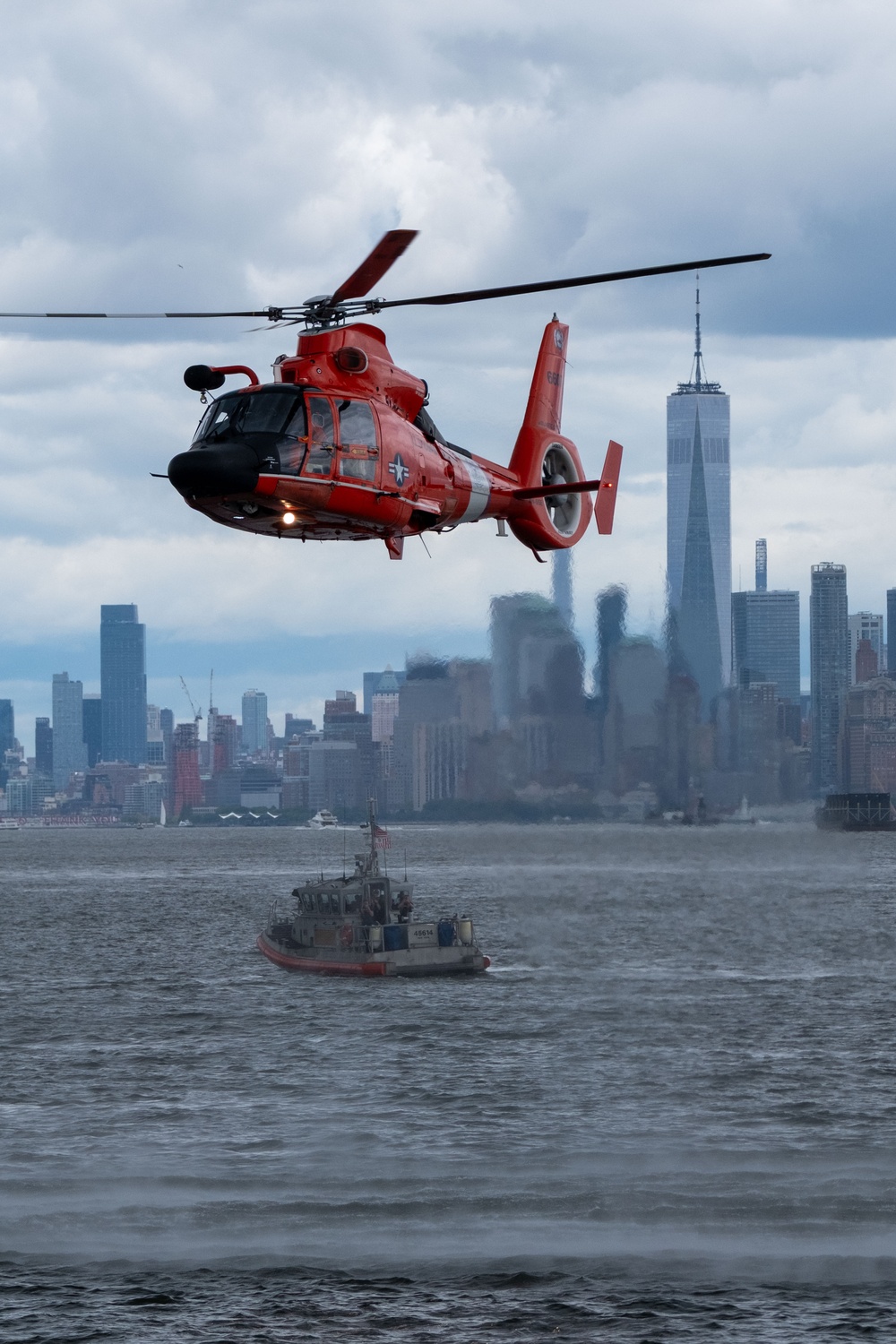 U.S. Coast Guard MH-65 dolphin conducts a search and rescue demonstration off the Homeport Pier in Staten Island during Fleet Week NYC 2025.