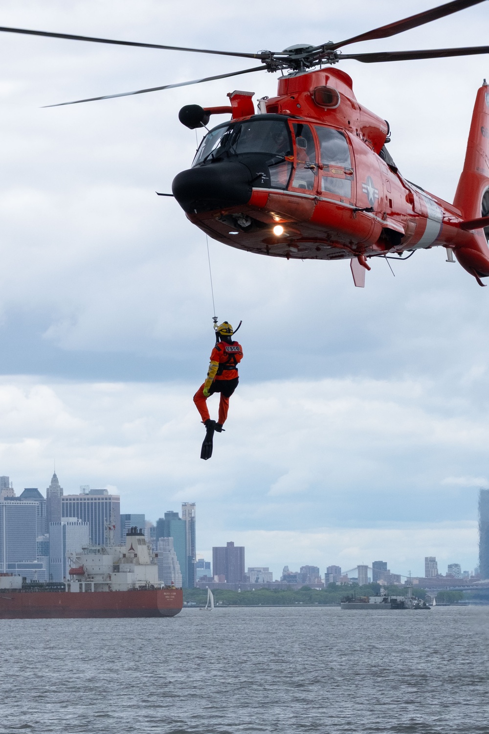 U.S. Coast Guard MH-65 dolphin conducts a search and rescue demonstration off the Homeport Pier in Staten Island during Fleet Week NYC 2025.