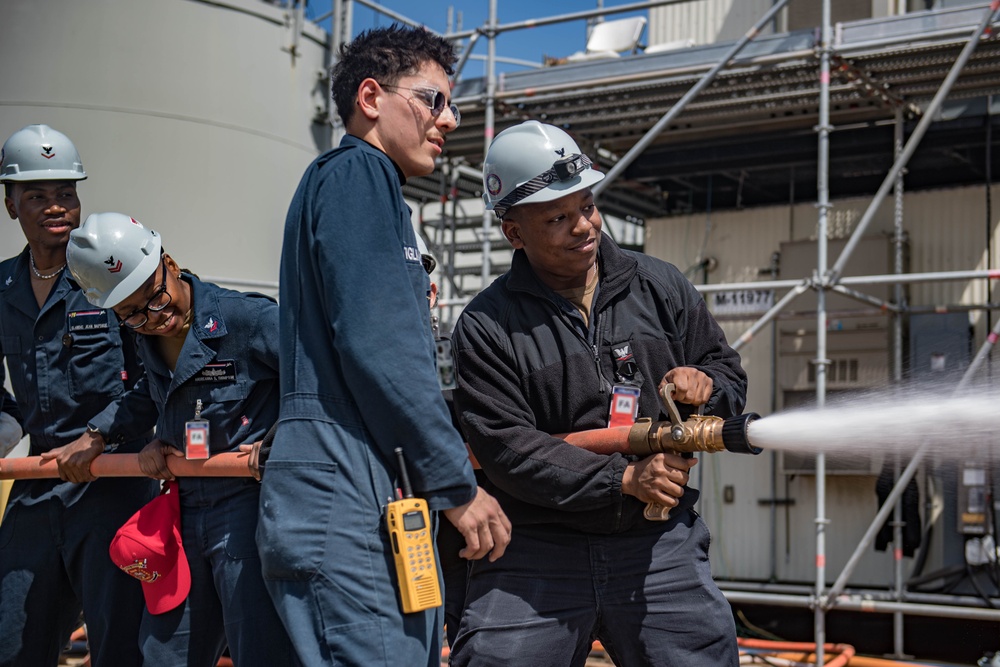 USS Ronald Reagan (CVN 76) Sailors conduct firefighting training