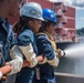 USS Ronald Reagan (CVN 76) Sailors conduct firefighting training