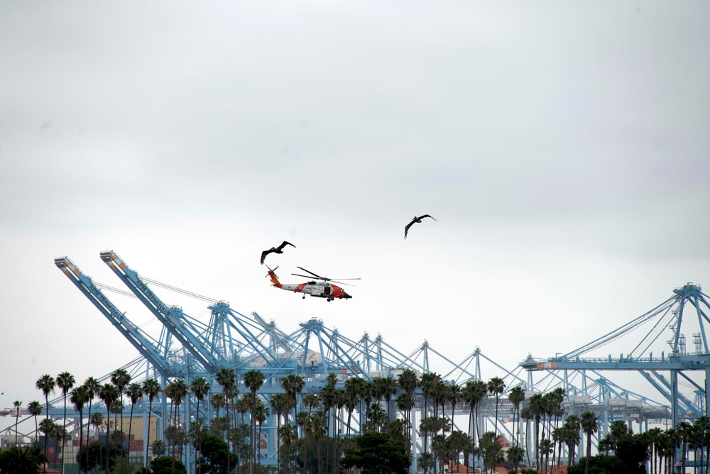 Coast Guard Jayhawk flies over the Port of Los Angeles