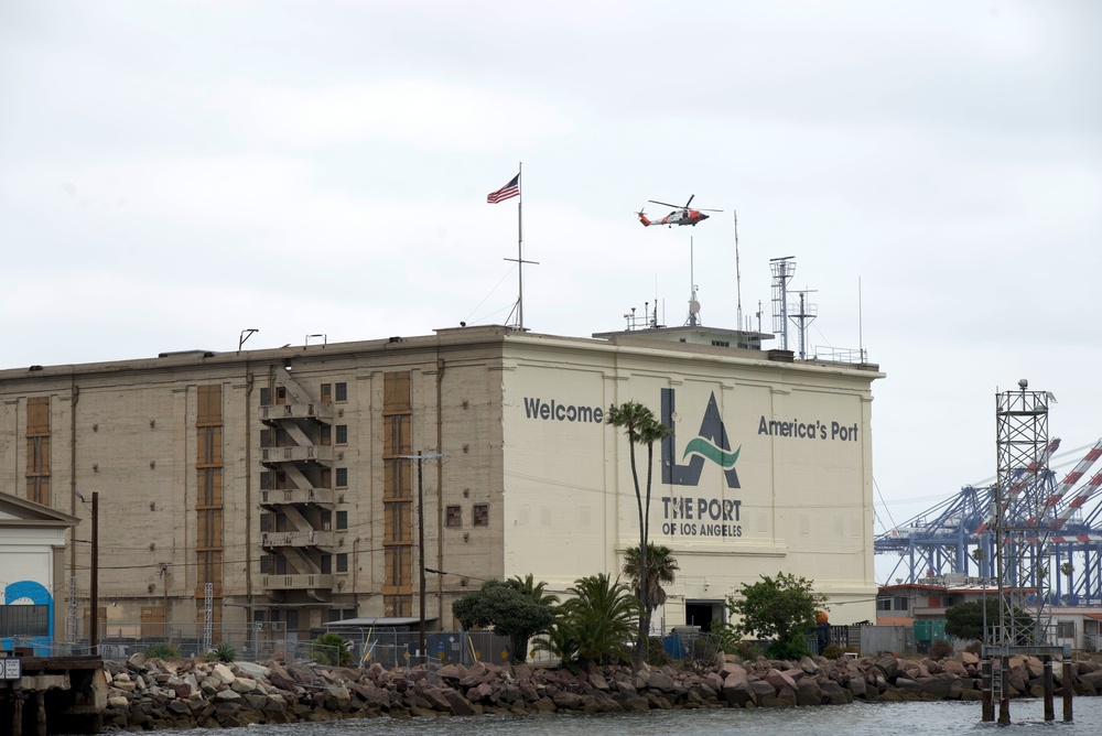 Coast Guard Jayhawk flies over the Port of Los Angeles