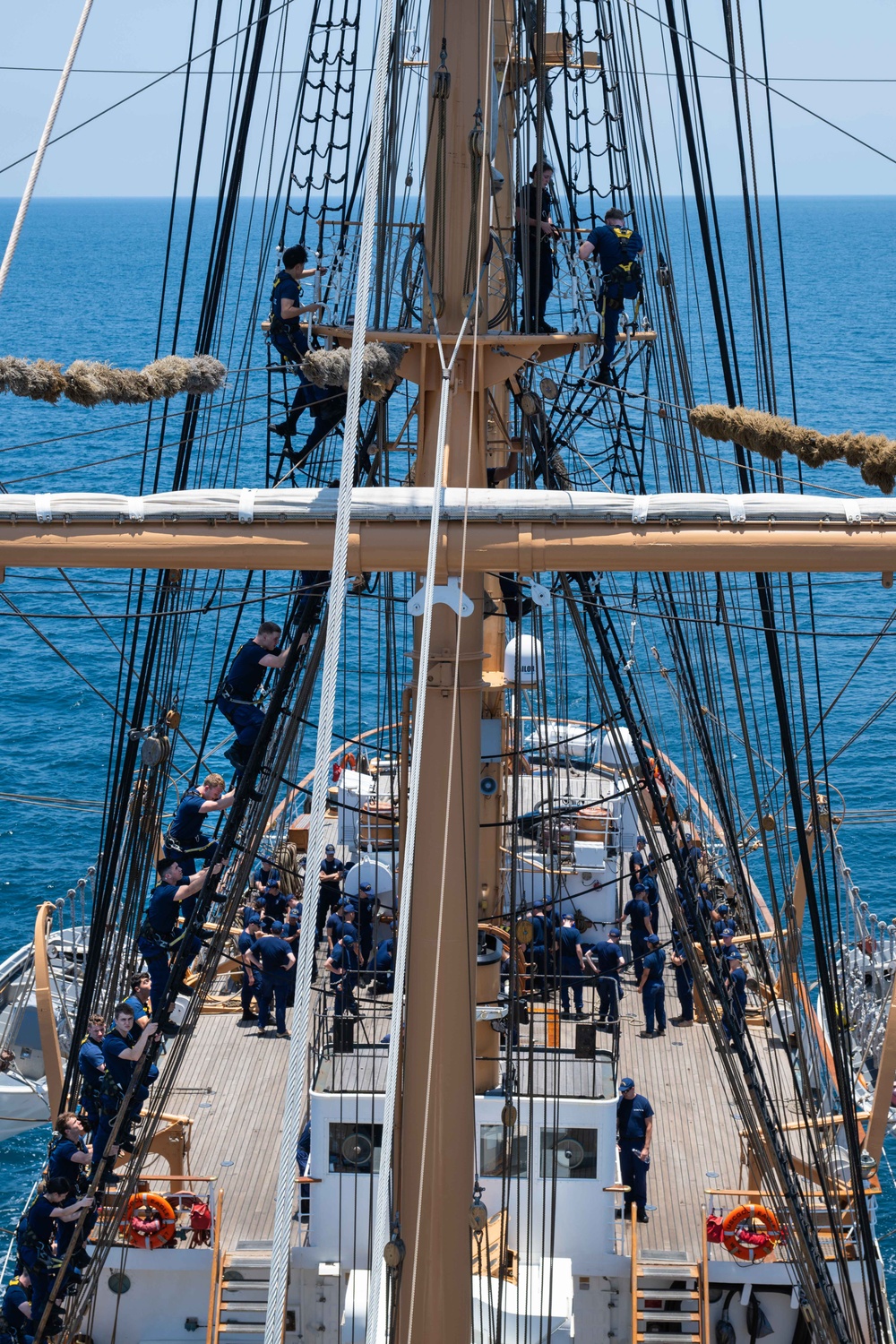 USCGC Eagle crew teaches cadets how to climb masts