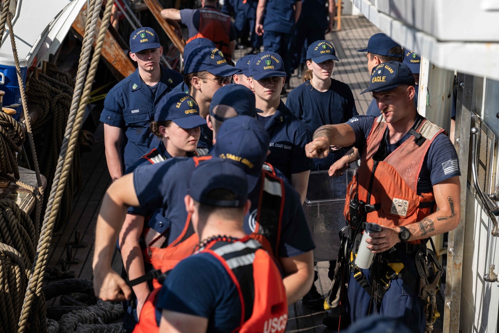 USCGC Eagle crew teaches cadets how to climb masts