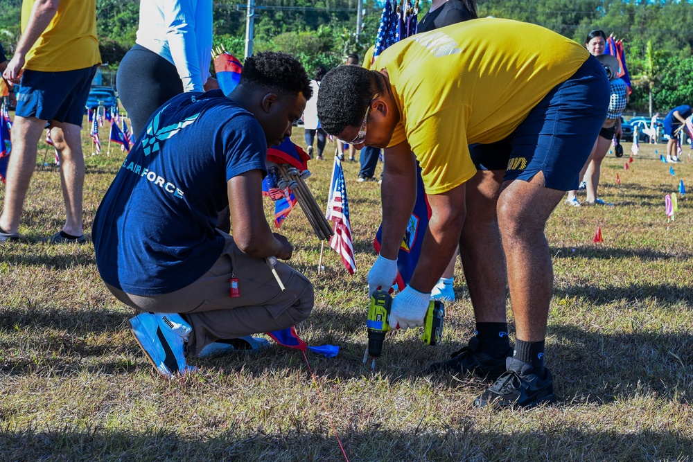 Military and civillian volunteers plant 3,050 flags for Memorial Day weekend