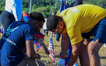 Military and civillian volunteers plant 3,050 flags for Memorial Day weekend