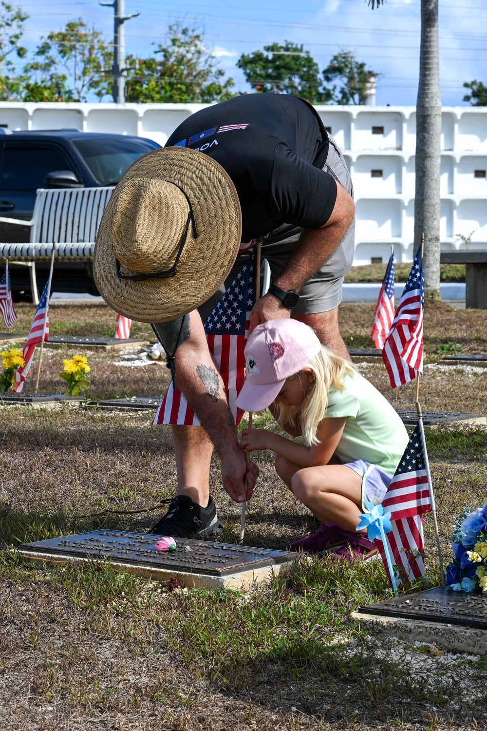Military and civillian volunteers plant 3,050 flags for Memorial Day weekend
