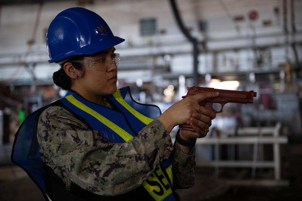 USS John C. Stennis (CVN 74) Sailors conduct a security drill