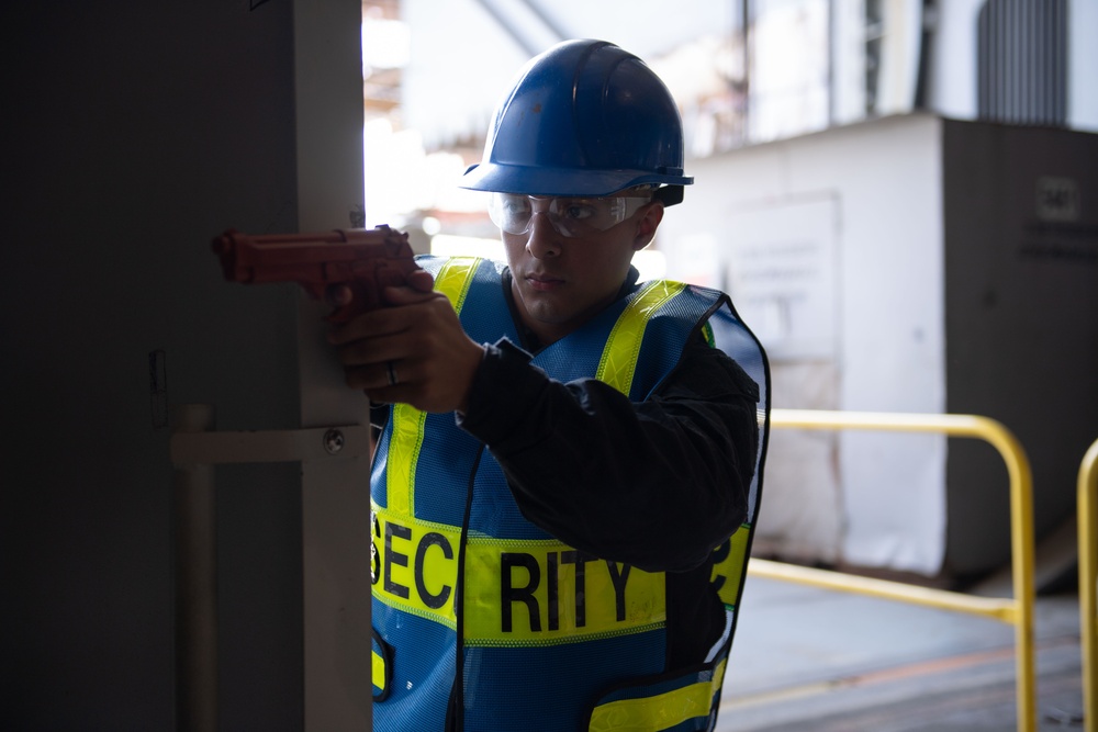 USS John C. Stennis (CVN 74) Sailors conduct a security drill