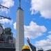 Gunner’s Mate 2nd Class Brennon Massaliga signals the crane operator to lower a Vertical Launching System