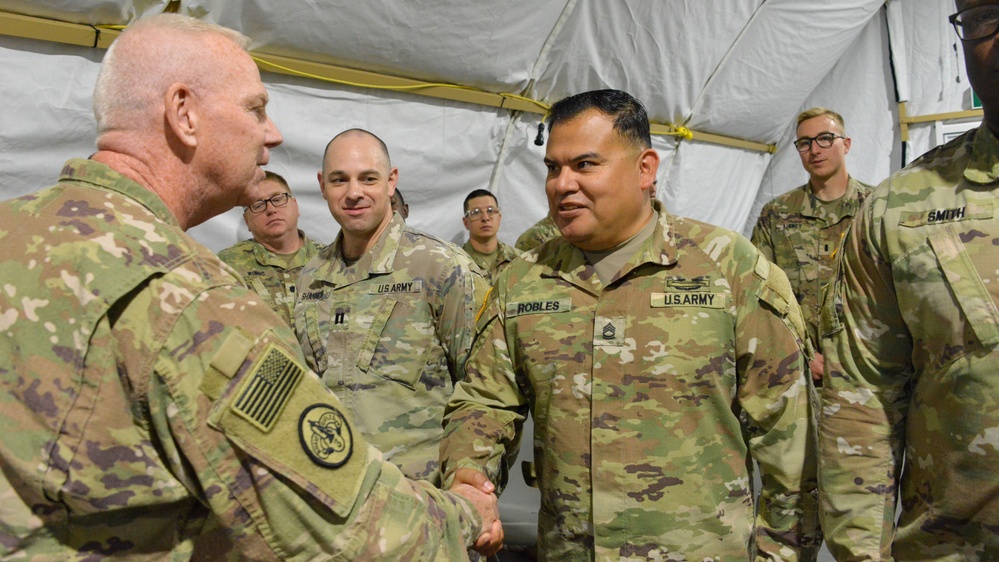 U.S. Soldiers receive coins