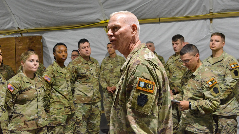 U.S. Soldiers receive coins