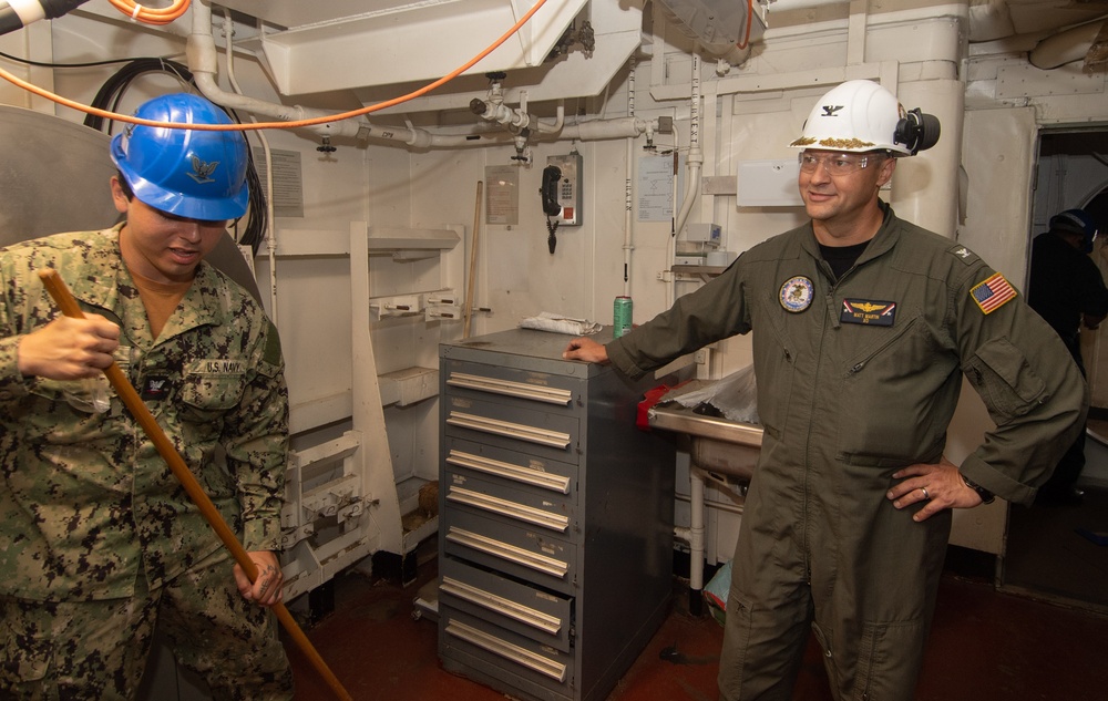 USS John C. Stennis (CVN 74) Executive Officer tours the ship during cleaning stations.