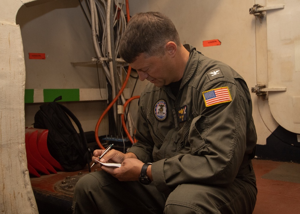 USS John C. Stennis (CVN 74) Executive Officer tours the ship during cleaning stations.